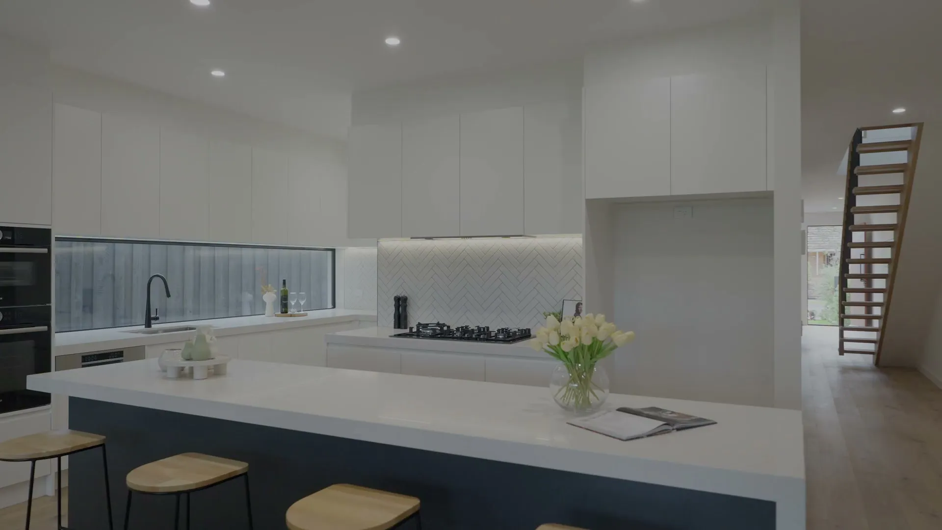 White custom kitchen with an island bench